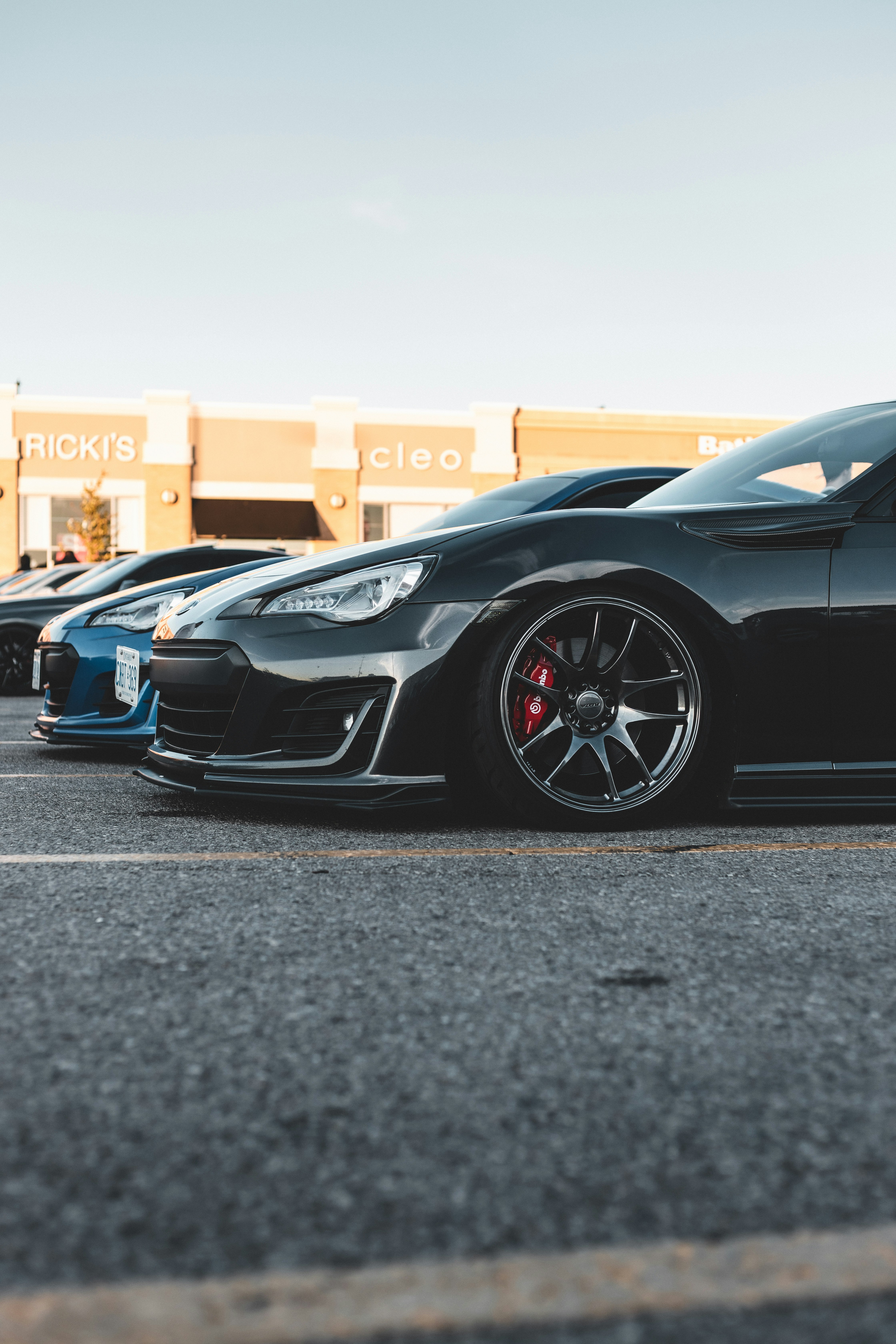 black lamborghini aventador parked on parking lot during daytime